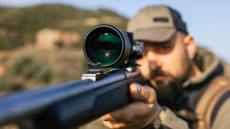 Hunter says he was walking out of public land when men in a blind yelled “I ought to pop one in you” — and then a shot rang out