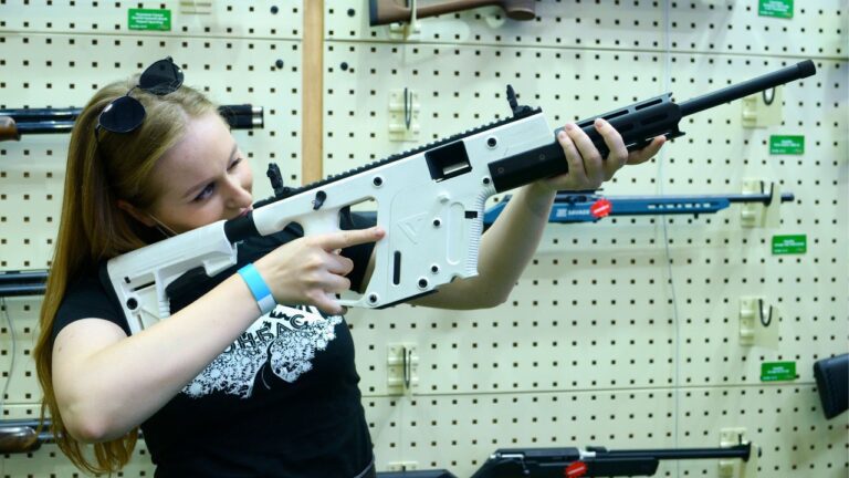 Couple says a gun-store employee treated their wife like a red flag, then another store blocked the sale entirely for 30 days