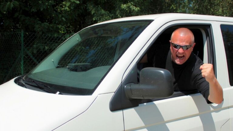 Driver says a van nearly clipped him on the highway — and by the time the road-rage driver jumped half out of his car with a huge screwdriver, the pistol was already in his lap