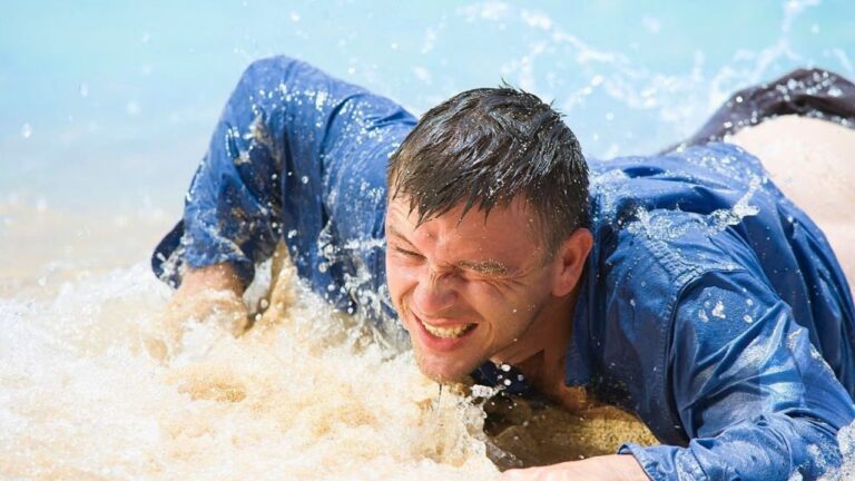 Fisherman says his dad slipped while wading a river and got swept downstream — and while he was fighting the current, a woman on shore started screaming that he wasn’t allowed to fish there