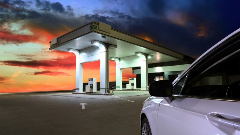 Traveler says he looked out the gas-station window and saw two big men walking straight toward his friend at the pump — and he drew before they reached her