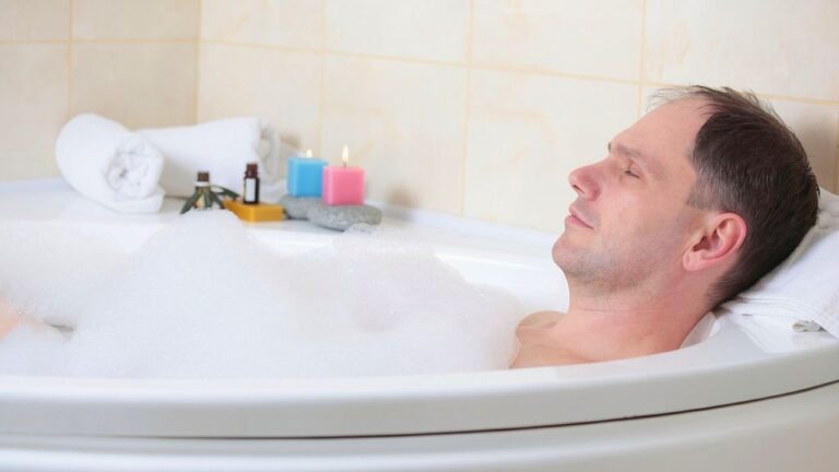 Man says he was asleep in his apartment bathtub when two armed intruders came in — and the only thing between him and them was a MAC-10 he kept under the sink