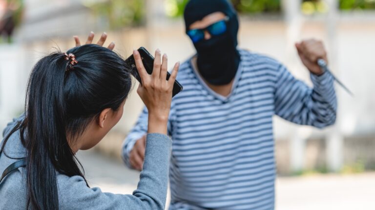 Traveler says he looked out the gas-station window and saw two men walking straight toward his friend with knives and zip ties — and he drew before they reached her