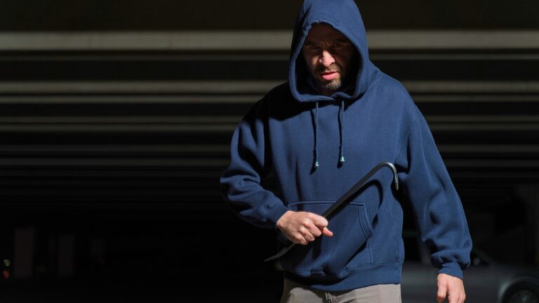 Worker says a man followed him into his job’s parking lot before dawn — and ran the second he saw the gun come out