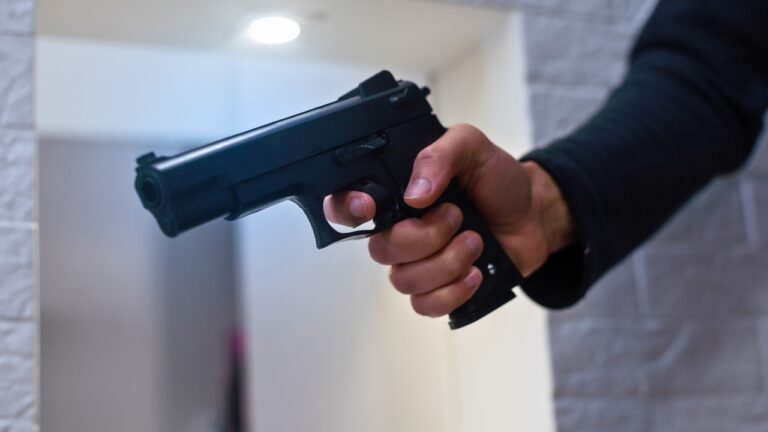 Man says he was walking home from a bar near the university when two guys in puffy jackets started shadowing him block for block — and he finally stopped, turned, and told one of them he had a gun