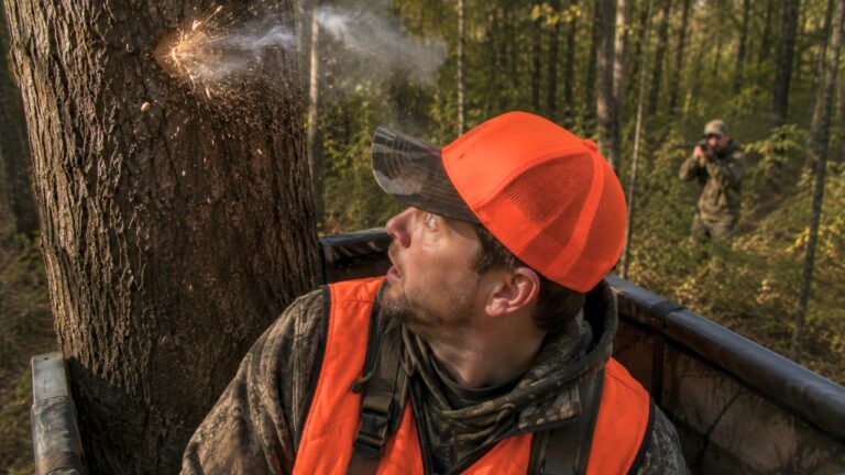 Hunter in Blaze Orange Says a .22 Round Hit the Tree Two Feet Above His Head — Then He Saw the Shooter Looking at Him Through the Scope