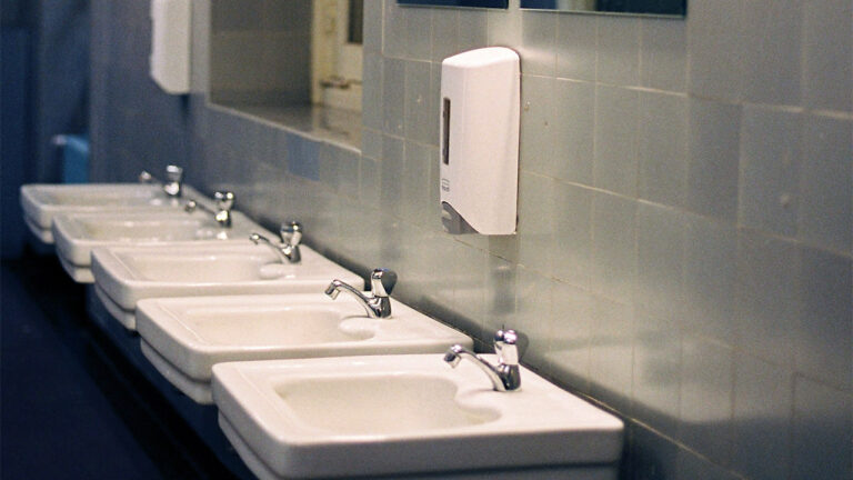 Carrier Says His Gun Skidded Into the Next Bathroom Stall — Then the Stranger Kicked It Back and Asked If He Was a Cop
